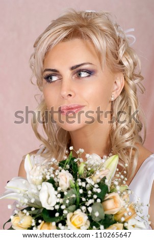 Beautiful bride with perfect hair in a white dress