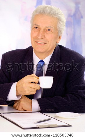 Cool elderly man in suit on light background