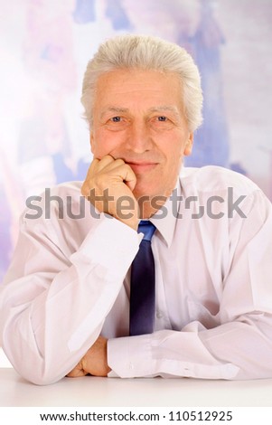 Cool elderly man in suit on light background