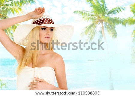 Pretty blonde with a bright appearance is resting at a resort