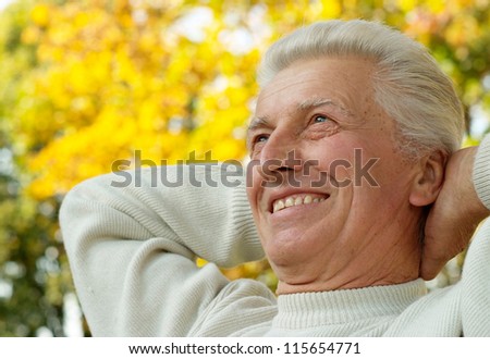 portrait of a happy man in autumn park