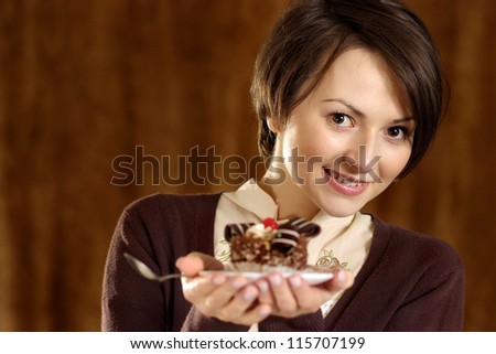 portrait of a nice woman with a cake in hand