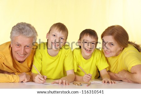 Cool family in yellow t-shirts having a good time together