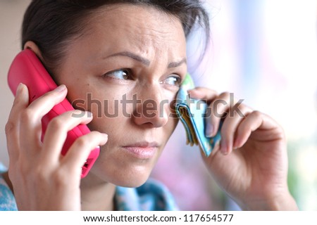 young woman with a handkerchief and a cold call the doctor