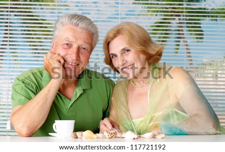 Nice old  couple went to a resort vacation
