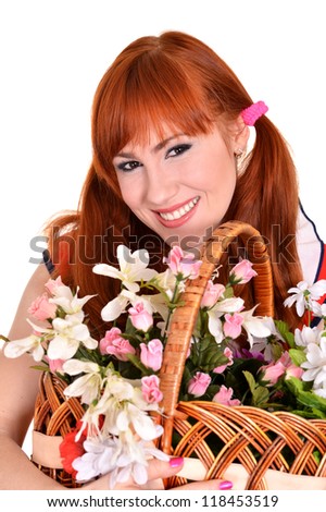 young pretty girl with a basket of flowers on a white background