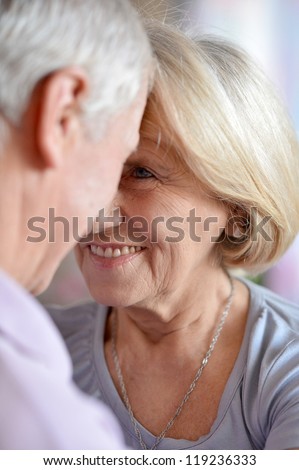 happy elderly couple posing in the room