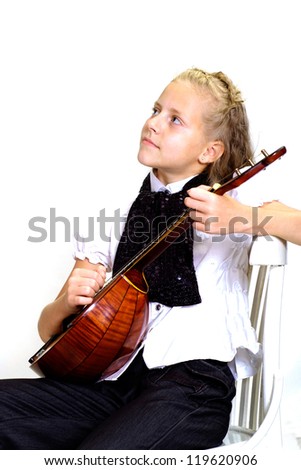 Funny child in the school of music on a white background