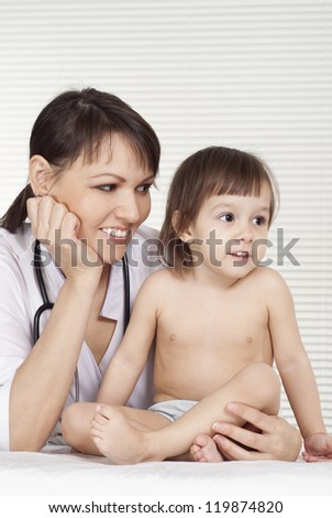 cute doctor with newborn on a white background