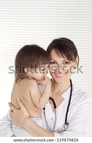 cute doctor with newborn on a white background