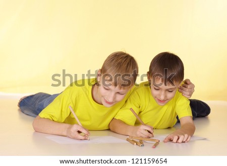 Positive family in yellow t-shirts having a good time together
