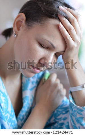 woman with handkerchief having cold with fever