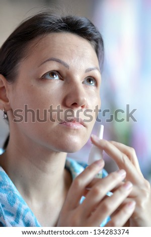 close-up portrait of a young woman to taking the medicine