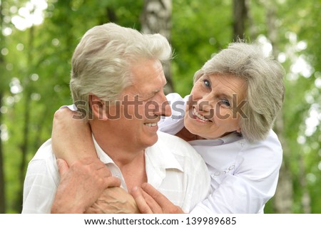 portrait of a happy elder couple in the late spring outside