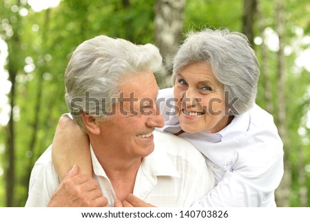 Portrait Of A Happy Elder Couple In The Late Spring Outside