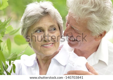 portrait of a happy middle-aged couple on a walk in the late spring