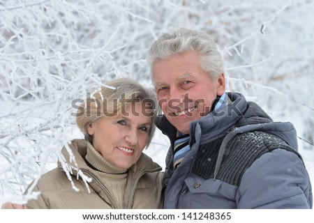 portrait of a happy middle-aged couple on a walk in winter
