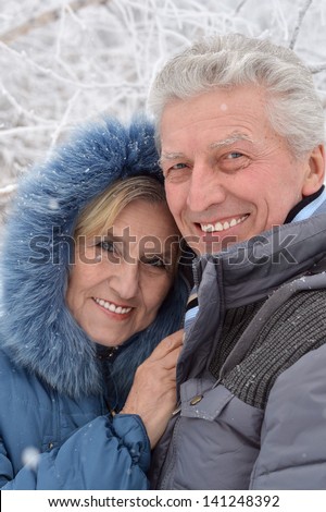 portrait of a happy middle-aged couple on a walk in winter