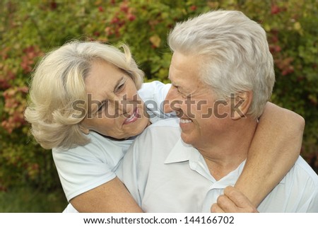 happy senior couple  on the background of  trees