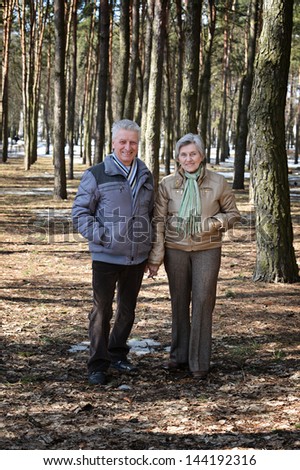 happy Mature couple on a walk in the forest in the spring