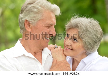 portrait of a happy elder couple in the late spring outside