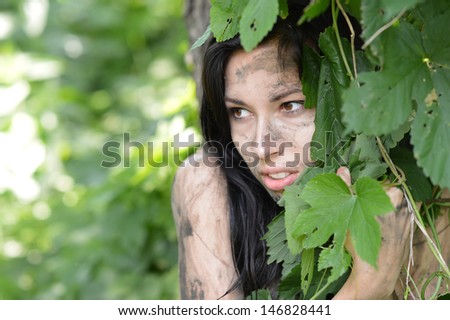 portrait of a young girl Hidden in the tall grass