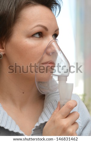portrait of a young woman being treated for a cold