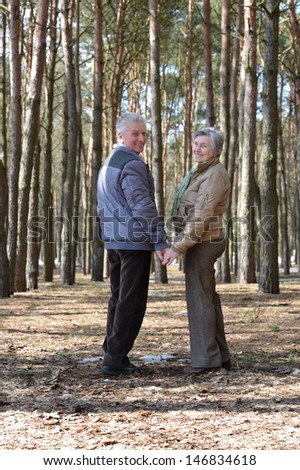 happy Mature couple on a walk in the forest in the spring