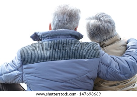 happy elderly couple on a walk in the park in spring