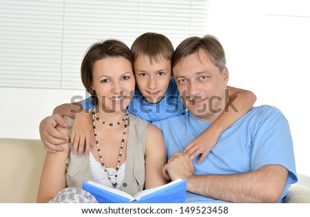 happy family resting at home on the couch together