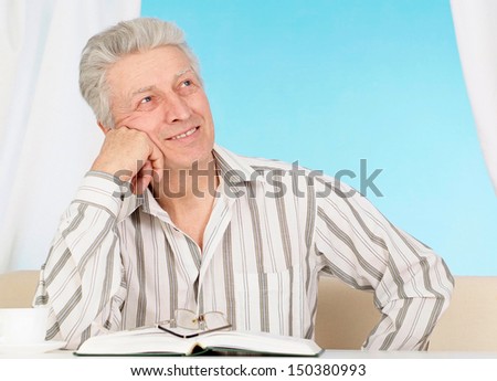 Happy elderly man in a beautiful room