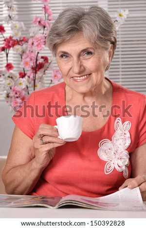 Portrait of an attractive elder woman at home