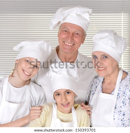 family knead the dough for the pie together