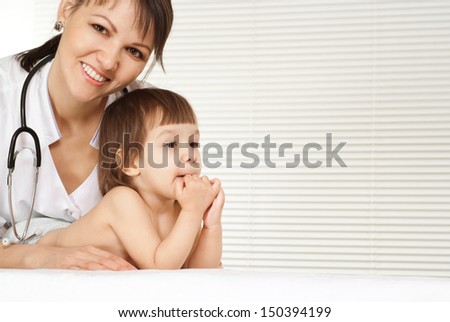 doctor with cute little girl on white background