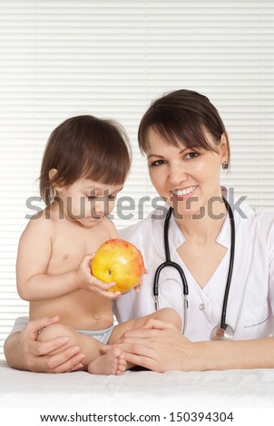 doctor with cute little girl on white background