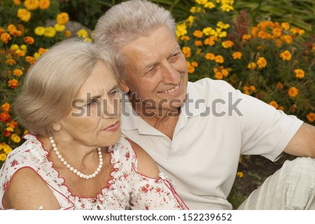 Lovely elderly couple decided to take a walk in the park