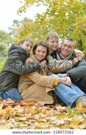 pretty happy family for a walk in the park fall