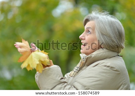 attractive elderly woman on walk fall