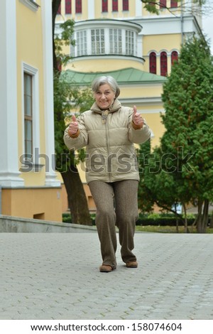 attractive elderly woman on walk fall