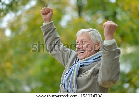 Attractive middle-aged man on a walk fall