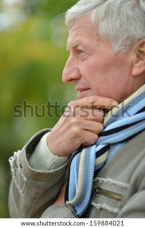 Attractive middle-aged man on a walk fall