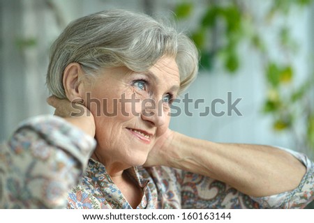 Portrait of an aged woman at home