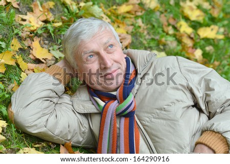 Attractive middle-aged man on a walk in autumn