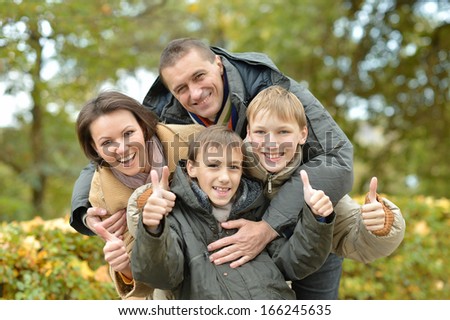 pretty happy family for a walk in the park fall