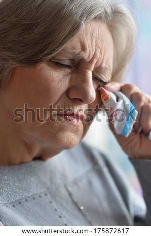 Portrait of an elderly sad woman