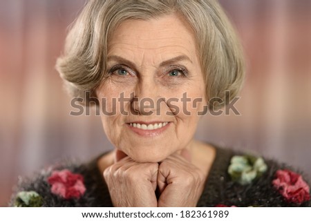 Portrait of a middle-aged woman isolated on colored background