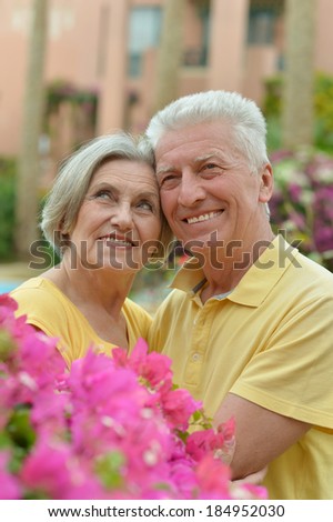 Loving happy elder couple at tropic resort