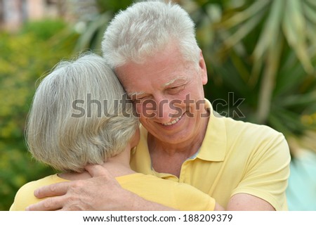 Loving happy elder couple at tropic resort