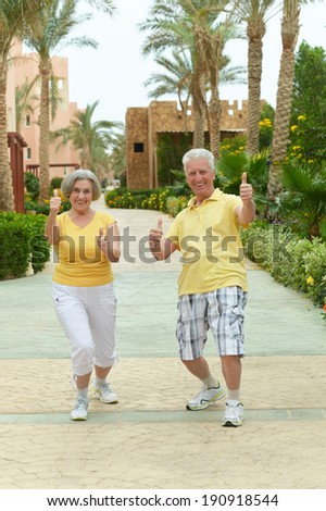 Happy loving elder couple at tropic resort