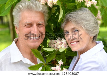 Portrait of a happy elder couple on a walk in the park